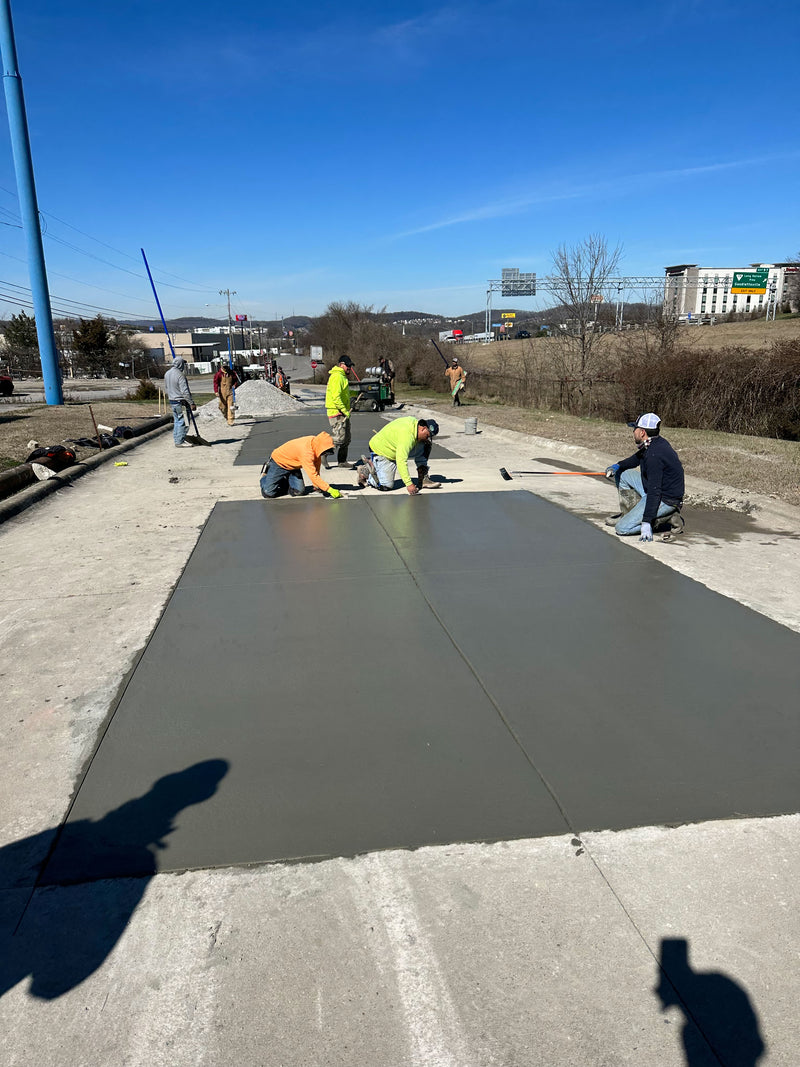 Select Concrete Services working on a fresh poured slab of concrete 